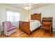 Bedroom with antique wood furnishings and decorative vintage armchair at 250 Blackberry Ln, Douglasville, GA 30134