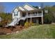 Inviting home with a spacious porch, showcasing well-maintained landscaping and a neatly manicured lawn at 250 Blackberry Ln, Douglasville, GA 30134