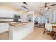 Open concept kitchen with island flows into a sunroom and living area at 250 Blackberry Ln, Douglasville, GA 30134