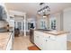 Kitchen island with stainless sink opens to a cozy sunroom at 250 Blackberry Ln, Douglasville, GA 30134