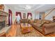 Warm living room with a stone fireplace, plush sofas, and elegant decor at 250 Blackberry Ln, Douglasville, GA 30134