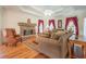 Elegant living room with a stone fireplace, hardwood floors, and classic furnishings at 250 Blackberry Ln, Douglasville, GA 30134