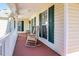 Relaxing porch featuring rocking chairs and views of the landscaped yard at 250 Blackberry Ln, Douglasville, GA 30134