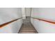 Stairway with carpeted steps and wooden handrails at 250 Blackberry Ln, Douglasville, GA 30134