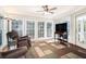 Bright sunroom with large windows and comfortable seating area at 250 Blackberry Ln, Douglasville, GA 30134