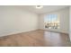 Neutral bedroom with hardwood floors and a large window for natural light at 2901 Lenox Ne Rd # 901, Atlanta, GA 30324