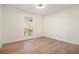 This bedroom has wood floors and a window with blinds, perfect for a comfortable retreat at 2901 Lenox Ne Rd # 901, Atlanta, GA 30324