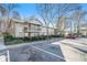 Apartment building featuring multiple units with balconies, parking, and landscaping at 2901 Lenox Ne Rd # 901, Atlanta, GA 30324