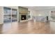 Bright living room with hardwood floors, fireplace, and sliding glass doors to balcony at 2901 Lenox Ne Rd # 901, Atlanta, GA 30324