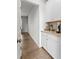 Convenient butler's pantry with granite countertops, providing additional storage and functionality at 133 Bastian Rd, Mcdonough, GA 30252