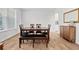 Dining room with seating for six, a buffet cabinet and natural light at 133 Bastian Rd, Mcdonough, GA 30252