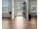 Bright foyer with wood floors and view of the home across the street at 133 Bastian Rd, Mcdonough, GA 30252