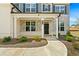 Inviting covered front porch with stone accents, offering a welcoming entrance to the home at 133 Bastian Rd, Mcdonough, GA 30252