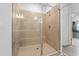 Luxurious bathroom featuring a glass-enclosed walk-in shower with tiled walls and a built-in bench at 133 Bastian Rd, Mcdonough, GA 30252