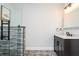 Modern bathroom featuring a glass-enclosed shower with tiled walls and a dark vanity with marble countertop at 2296 Valley Brook Ne Way, Atlanta, GA 30319
