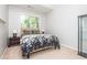 Cozy bedroom with a window, a queen-sized bed, and side tables with lamps at 2296 Valley Brook Ne Way, Atlanta, GA 30319