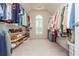 Large walk-in closet featuring custom shelving and hanging rods for ample storage at 2296 Valley Brook Ne Way, Atlanta, GA 30319