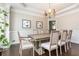 Elegant dining room with a wooden table, eight chairs, and modern chandelier at 2296 Valley Brook Ne Way, Atlanta, GA 30319