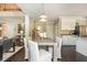 Bright dining area featuring a modern light fixture, seating for four, and hardwood floors at 2296 Valley Brook Ne Way, Atlanta, GA 30319