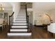 Welcoming foyer with staircase and hardwood floors, leading to living and dining areas at 2296 Valley Brook Ne Way, Atlanta, GA 30319