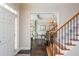 Open foyer with hardwood floors, staircase and adjacent dining room at 2296 Valley Brook Ne Way, Atlanta, GA 30319