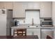 Close up of a kitchenette with a sink, microwave and stainless steel refrigerator at 2296 Valley Brook Ne Way, Atlanta, GA 30319