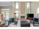 Bright living room features a fireplace, high ceilings and large windows offering ample natural light at 2296 Valley Brook Ne Way, Atlanta, GA 30319