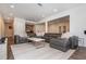 Spacious living room with a comfortable leather sectional sofa and bright recessed lighting at 2296 Valley Brook Ne Way, Atlanta, GA 30319