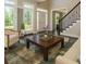 Inviting living room featuring hardwood floors, fireplace, and abundant natural light from large windows at 2296 Valley Brook Ne Way, Atlanta, GA 30319