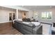 Open living room features a gray leather couch and ample natural light at 2296 Valley Brook Ne Way, Atlanta, GA 30319