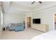 Relaxing primary bedroom showcasing a sitting area, tray ceiling, and soothing colors at 2296 Valley Brook Ne Way, Atlanta, GA 30319