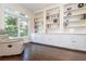 Bright office space featuring custom built-in bookshelves, cabinets and a comfortable leather chair at 2296 Valley Brook Ne Way, Atlanta, GA 30319