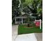 Charming single-story home with a welcoming front porch and well-maintained lawn at 305 Henry Aaron Sw Ave, Atlanta, GA 30310