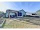 Wide angle of the property's backyard including a charming patio and screened-in porch at 4230 Braden Nw Ln, Kennesaw, GA 30144