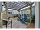 Relaxing backyard patio featuring brick pavers, comfortable seating, and a wooden pergola for shade at 4230 Braden Nw Ln, Kennesaw, GA 30144