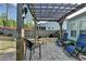 Charming backyard patio with brick pavers, wooden pergola, and comfortable seating for outdoor enjoyment at 4230 Braden Nw Ln, Kennesaw, GA 30144