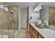 Bathroom featuring a glass-enclosed shower, double vanity, and ample counter space at 4230 Braden Nw Ln, Kennesaw, GA 30144