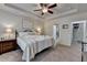 Cozy bedroom with a ceiling fan and access to the bathroom and walk-in closet at 4230 Braden Nw Ln, Kennesaw, GA 30144