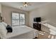 Cozy bedroom with lots of sunlight from window with white shutters, and decorative dresser at 4230 Braden Nw Ln, Kennesaw, GA 30144