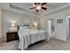 Bedroom featuring a ceiling fan, bedside tables, and neutral color scheme at 4230 Braden Nw Ln, Kennesaw, GA 30144