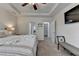 Bedroom with a tray ceiling, carpeted floor, and views of the bathroom at 4230 Braden Nw Ln, Kennesaw, GA 30144