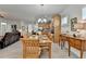 Dining area with wood floors, a wooden table set, and access to the living area and kitchen at 4230 Braden Nw Ln, Kennesaw, GA 30144