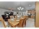Open-concept living and dining area with wooden furniture, an area rug, and cozy seating at 4230 Braden Nw Ln, Kennesaw, GA 30144