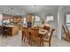Dining room and kitchen area with light wood cabinetry, an island, and lots of natural light at 4230 Braden Nw Ln, Kennesaw, GA 30144