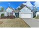 Charming, light blue single-story home featuring a two-car garage and well-maintained front yard at 4230 Braden Nw Ln, Kennesaw, GA 30144