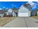 Charming, light blue single-story home featuring a two-car garage and well-maintained front yard at 4230 Braden Nw Ln, Kennesaw, GA 30144
