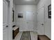Hallway with light wood floor, bench with storage, and natural light at 4230 Braden Nw Ln, Kennesaw, GA 30144