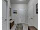 Hallway with light wood floor, bench with storage, and natural light at 4230 Braden Nw Ln, Kennesaw, GA 30144