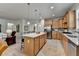 Spacious kitchen with custom cabinetry, stainless steel appliances, a large center island, and ample counter space at 4230 Braden Nw Ln, Kennesaw, GA 30144