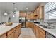 Beautiful kitchen featuring custom cabinets, stainless steel appliances, and a large center island with seating at 4230 Braden Nw Ln, Kennesaw, GA 30144